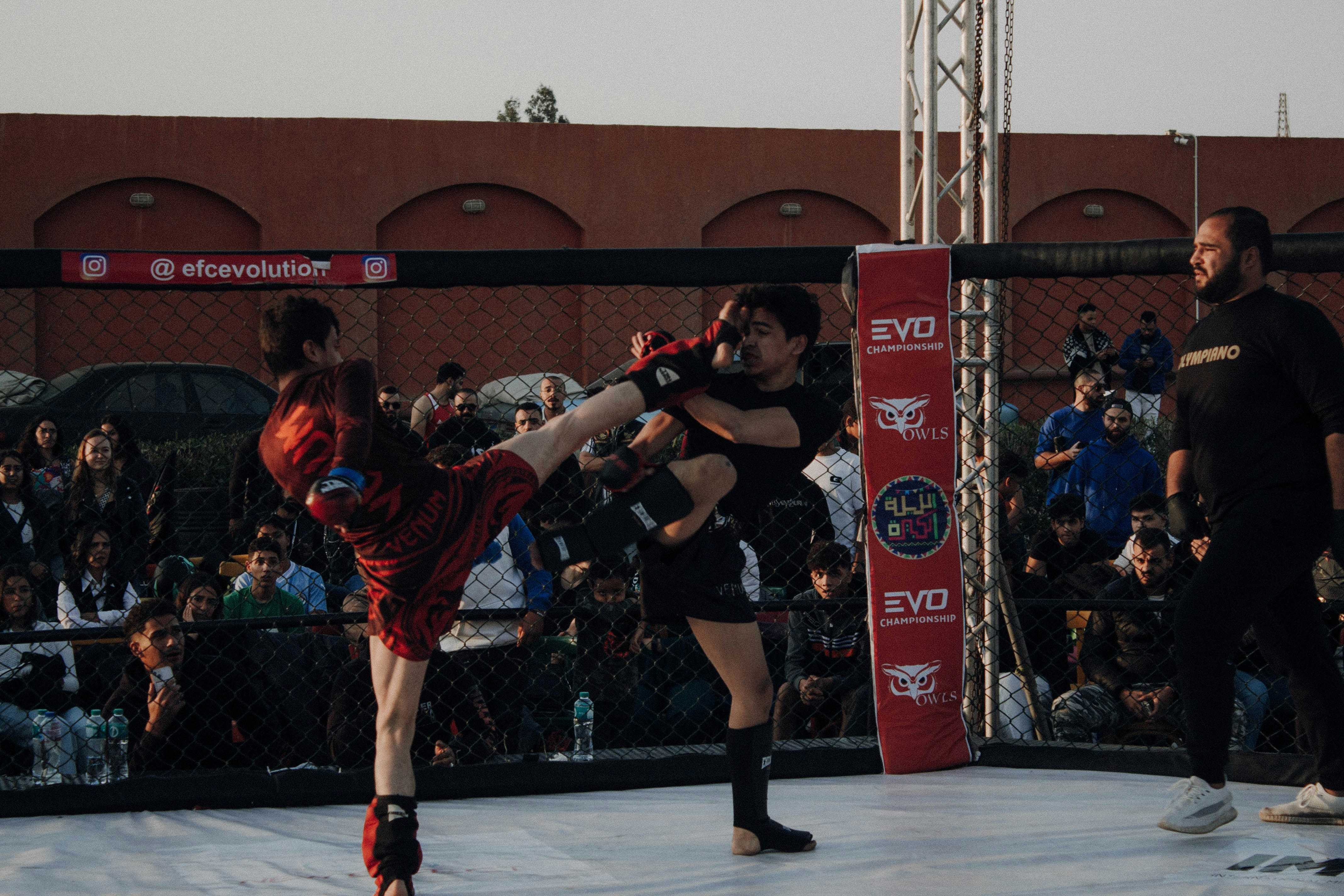 Two men standing on a wrestling ring