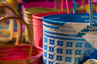 A close up of a basket with pins in it