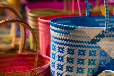 A close up of a basket with pins in it