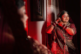 A woman standing in front of a mirror