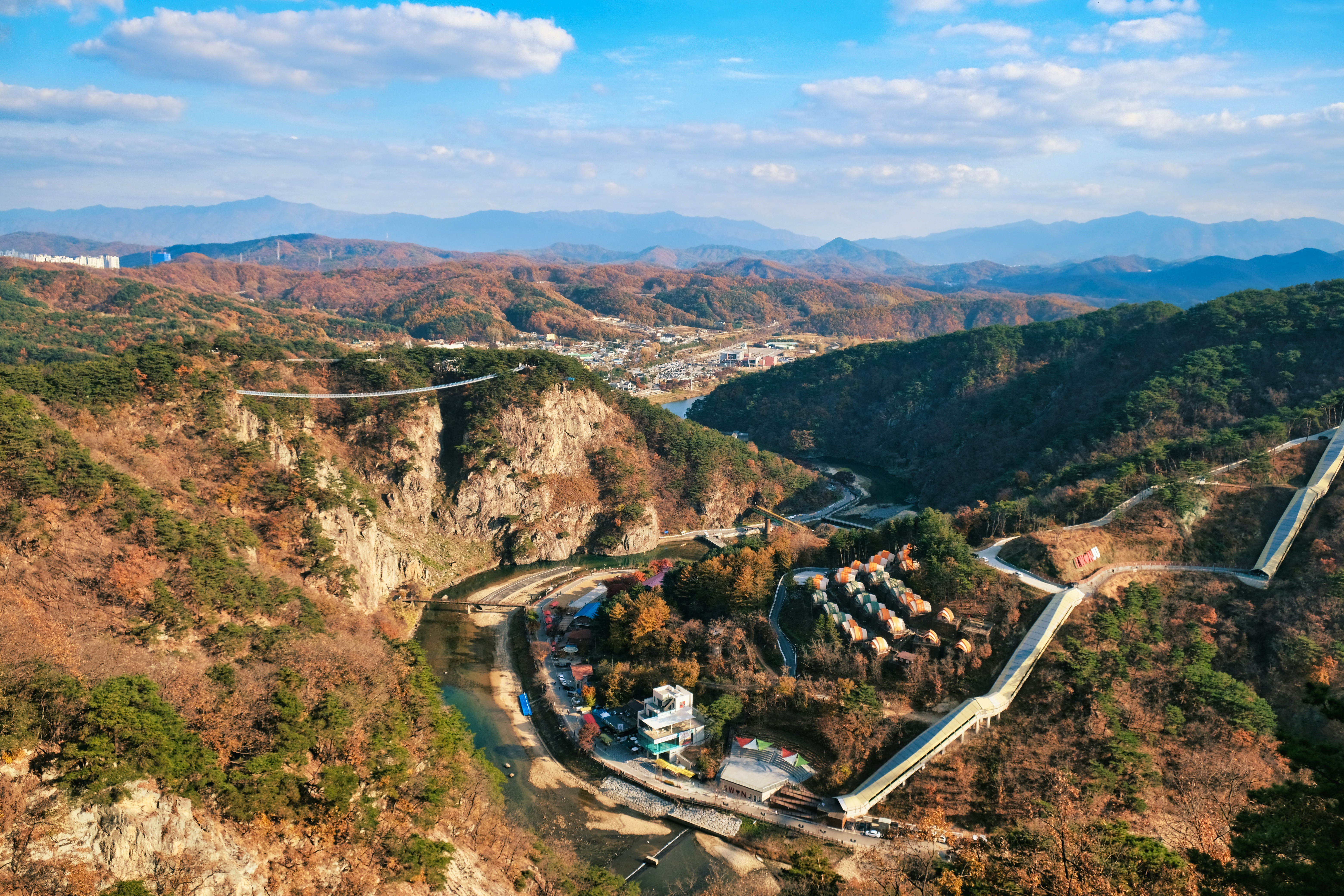 An aerial view of a mountain with a river running through it
