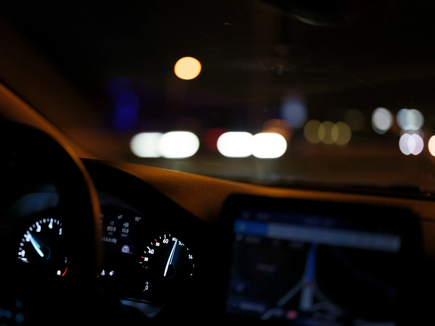 Illuminated vehicle instrument cluster at night