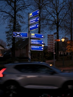 A car driving down a street at night