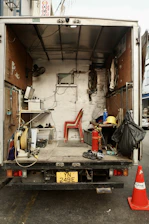 The back of a truck with the door open