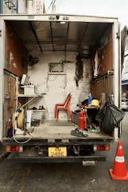 The back of a truck with the door open