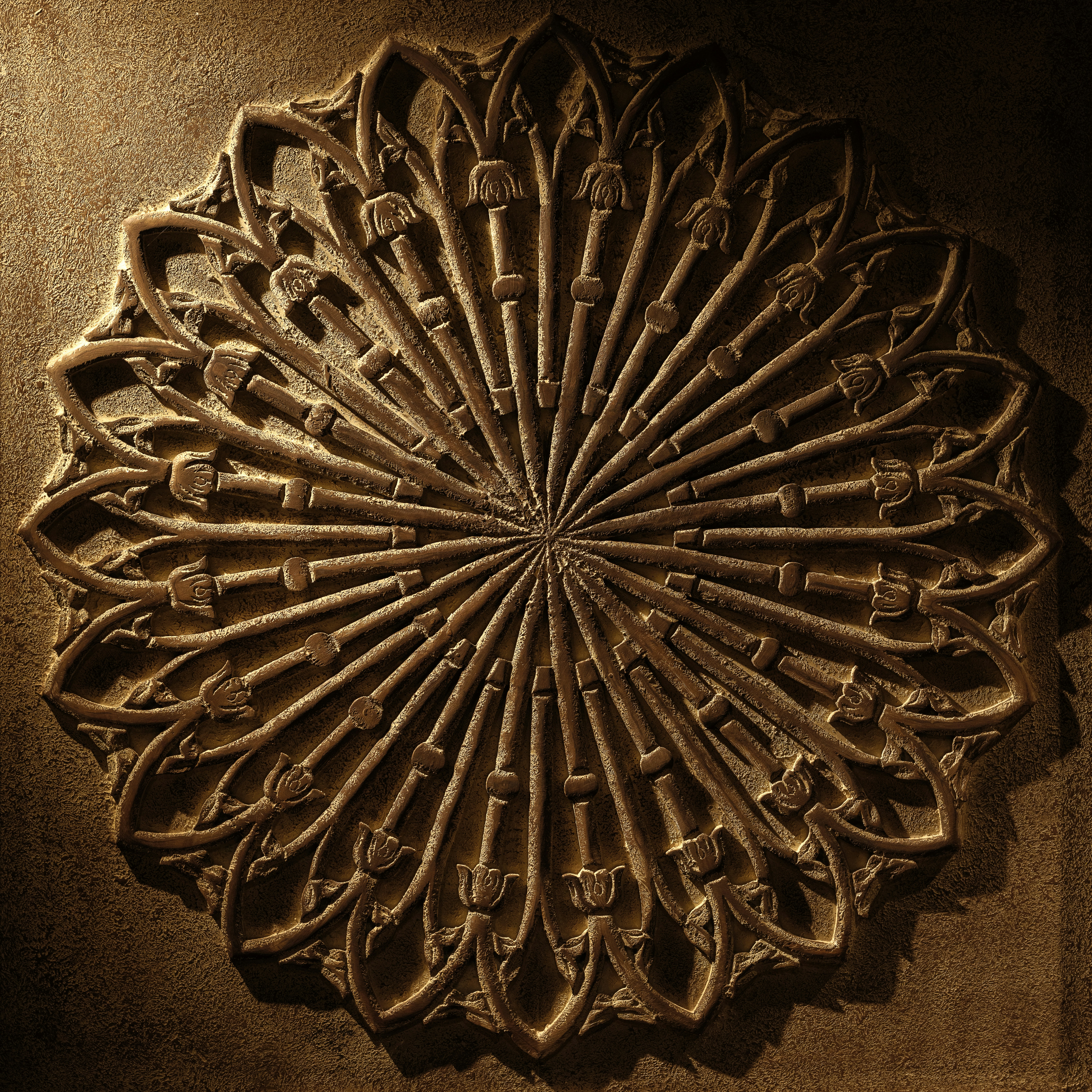 A decorative wall hanging on the side of a building