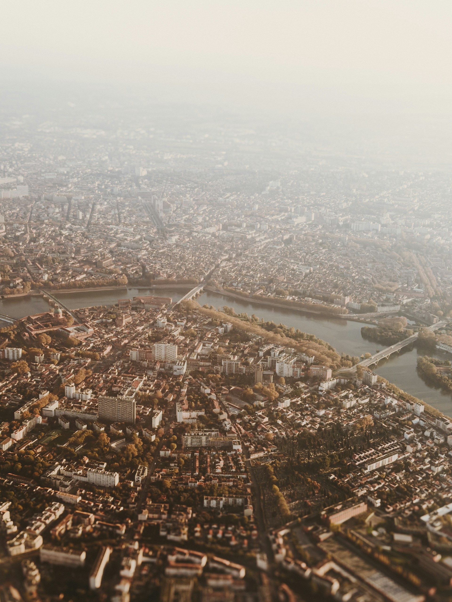 An aerial view of a city and a river