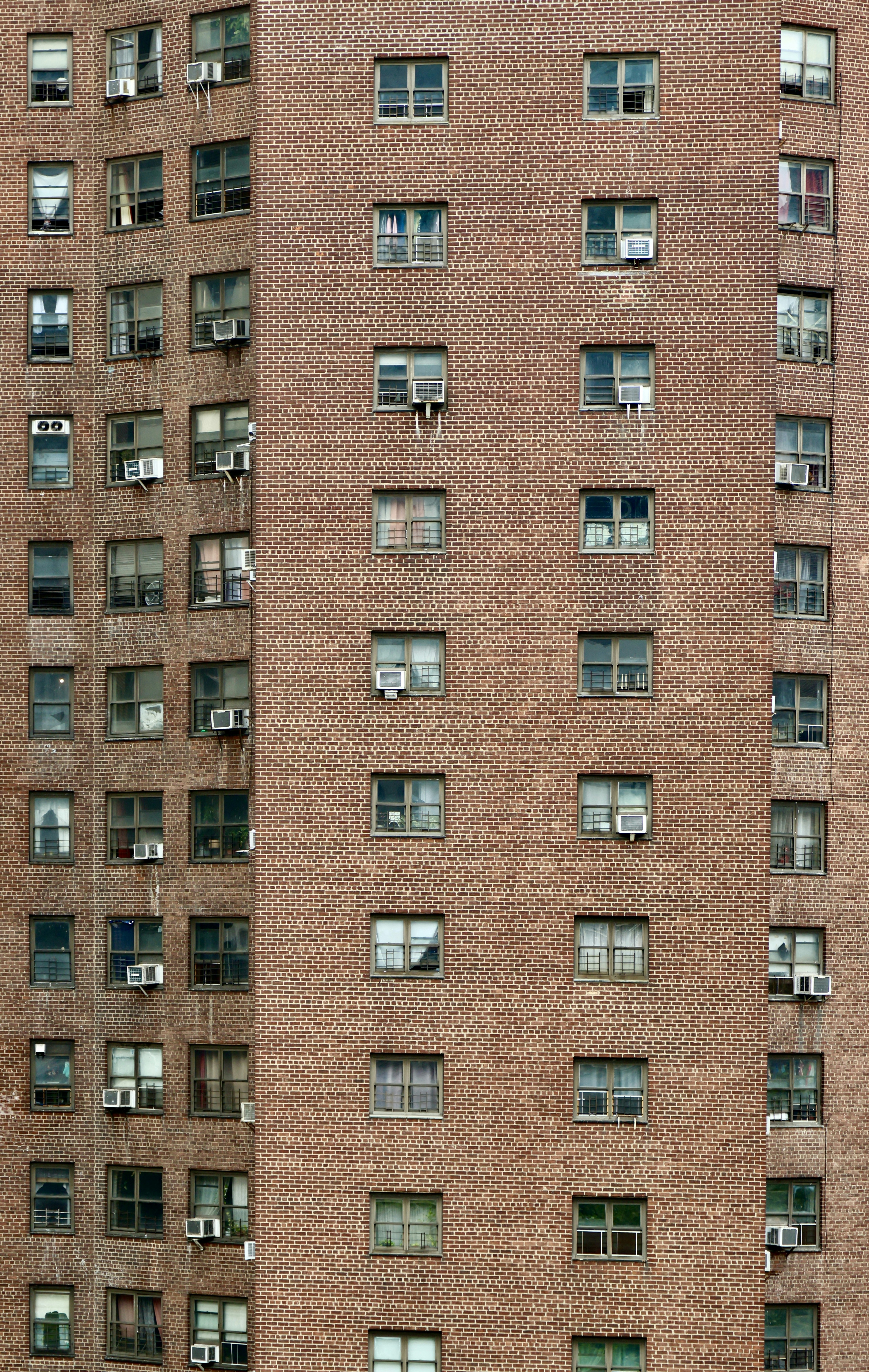 A tall brick building with lots of windows