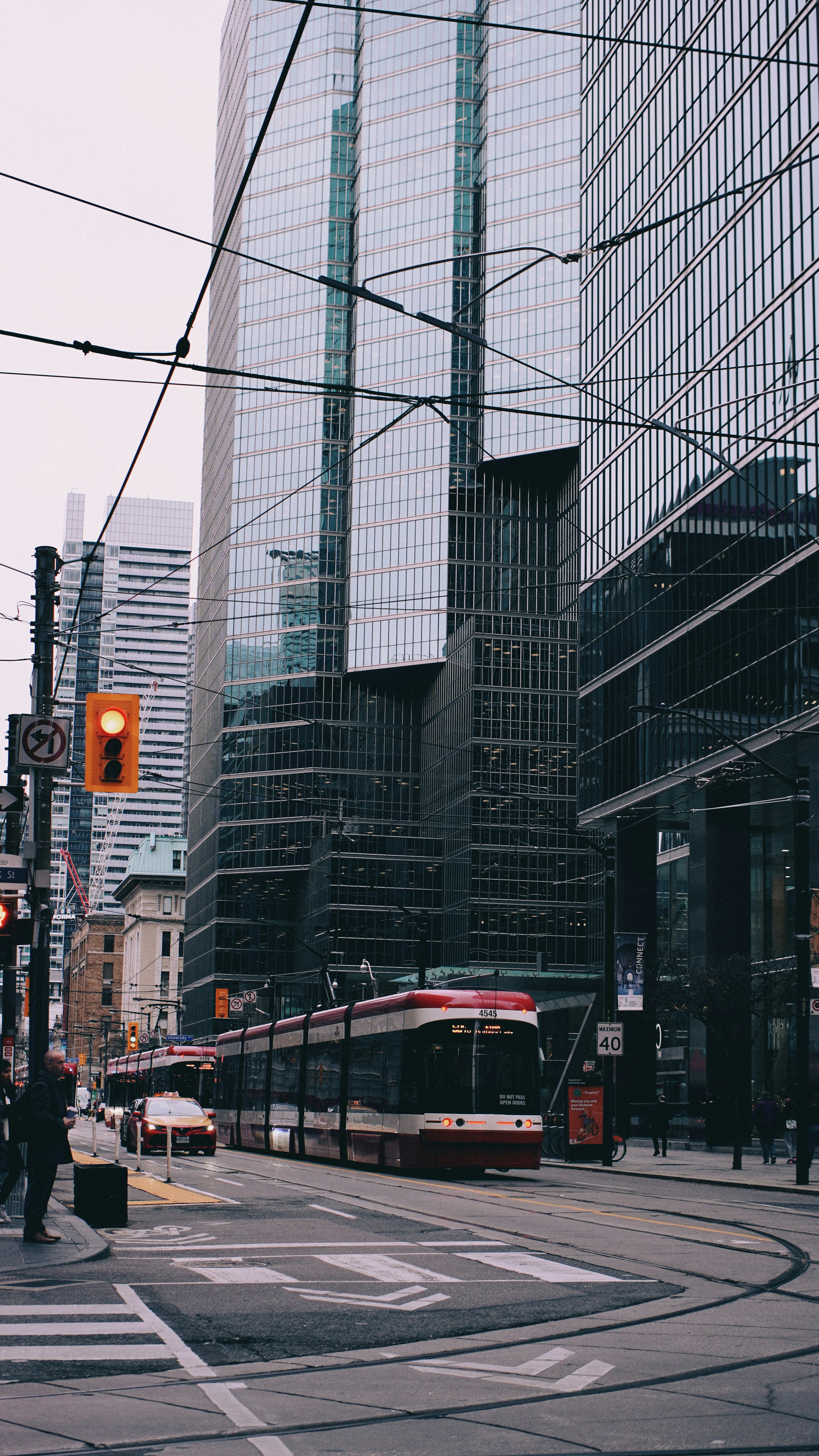 A city street filled with traffic next to tall buildings photo – Free ...
