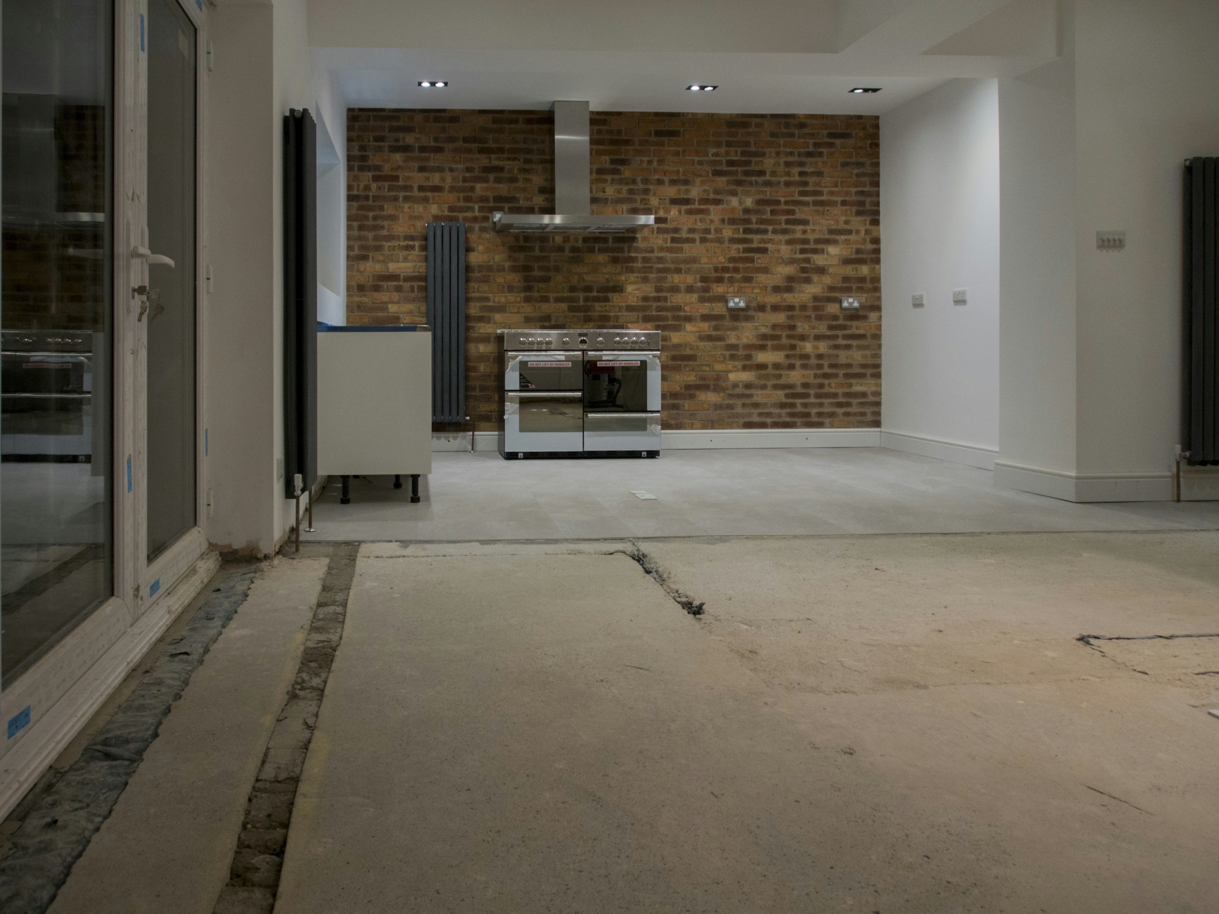 Empty kitchen with brick wall