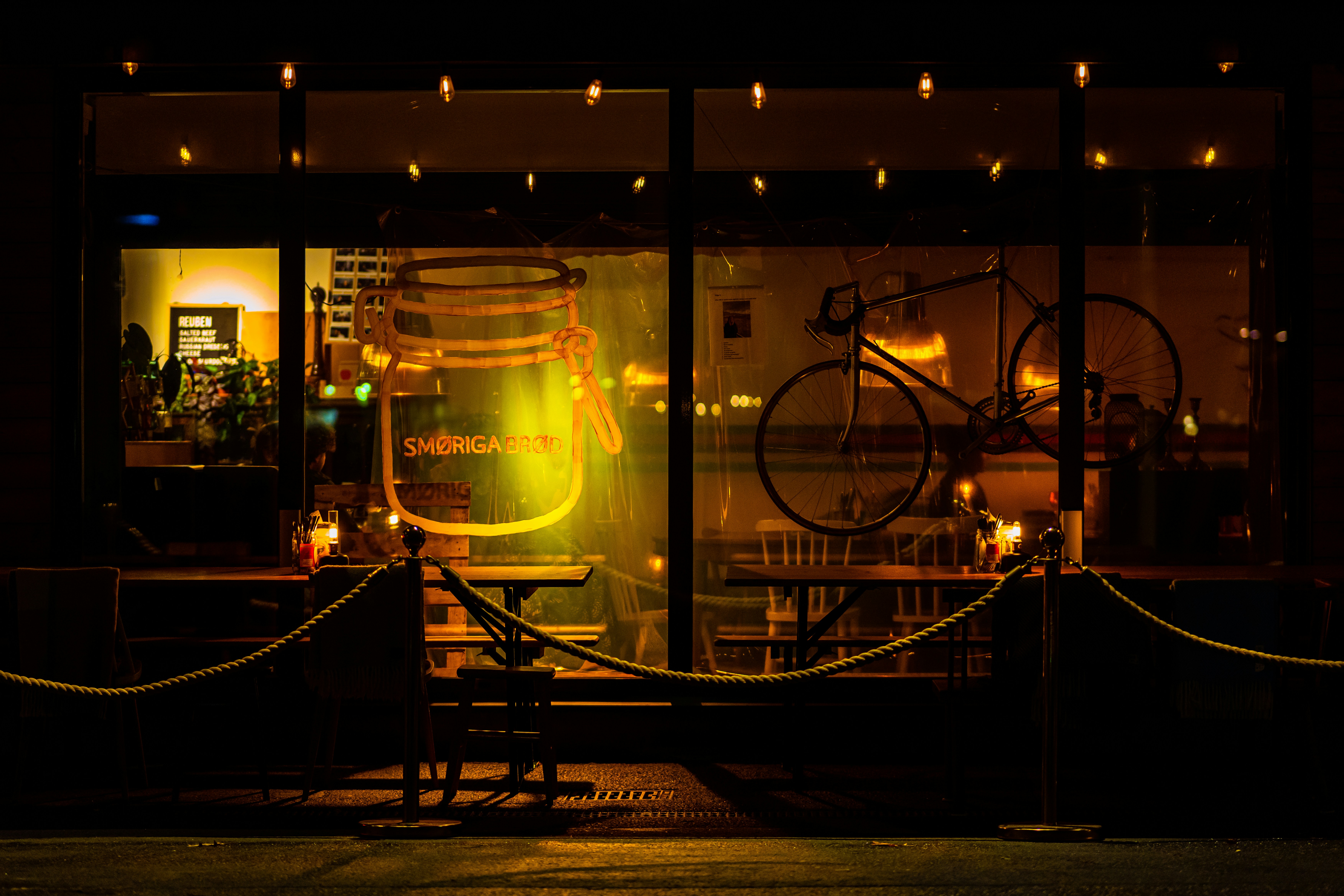 Store front at night with bicycle