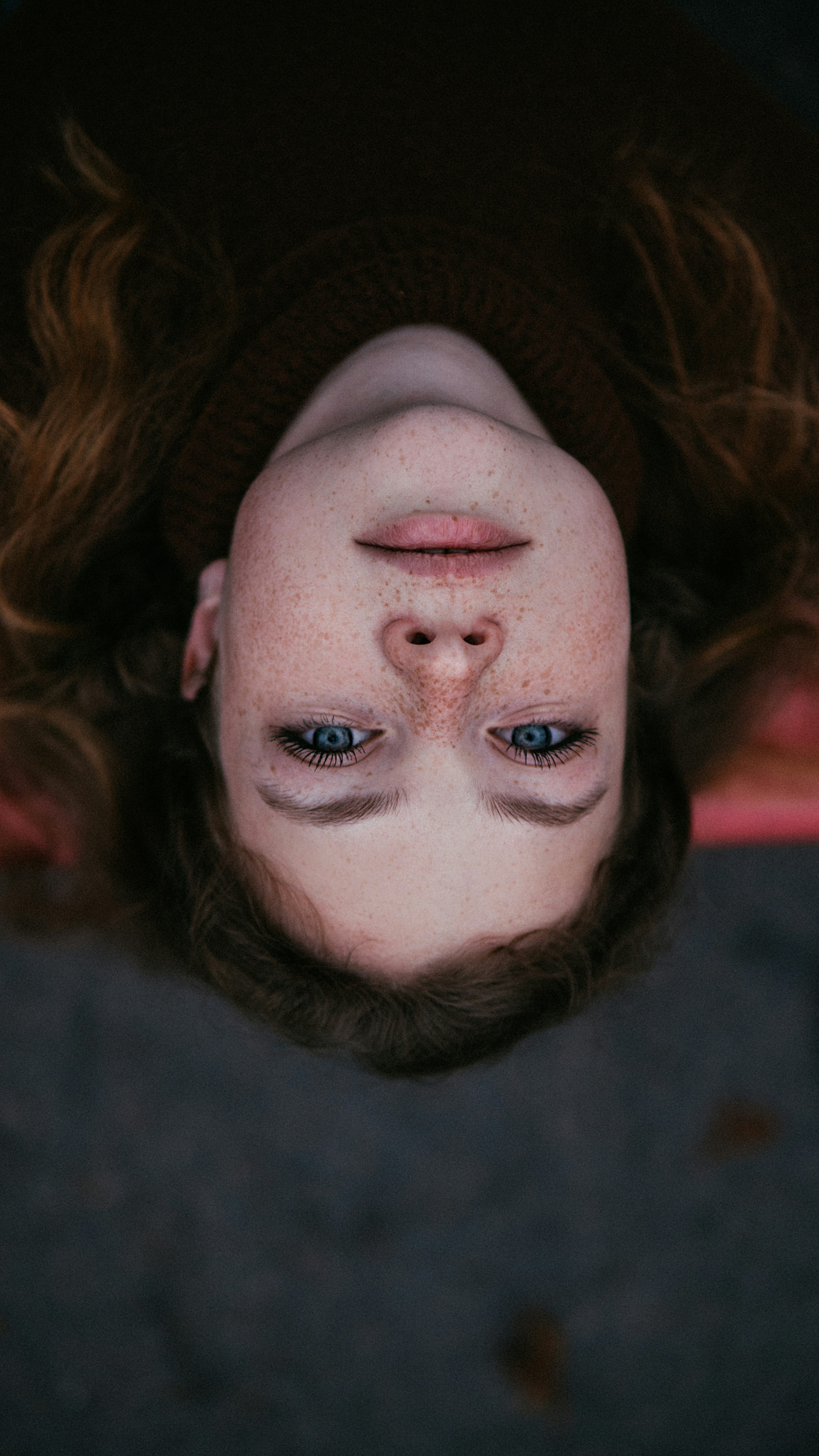 A woman with her face painted like a clown