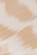 A blurry photo of a person holding a cell phone