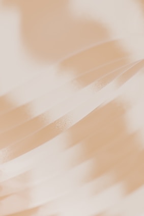 A blurry photo of a person holding a cell phone