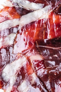 A close up of sliced meat on a plate