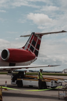 A large jetliner sitting on top of an airport tarmac