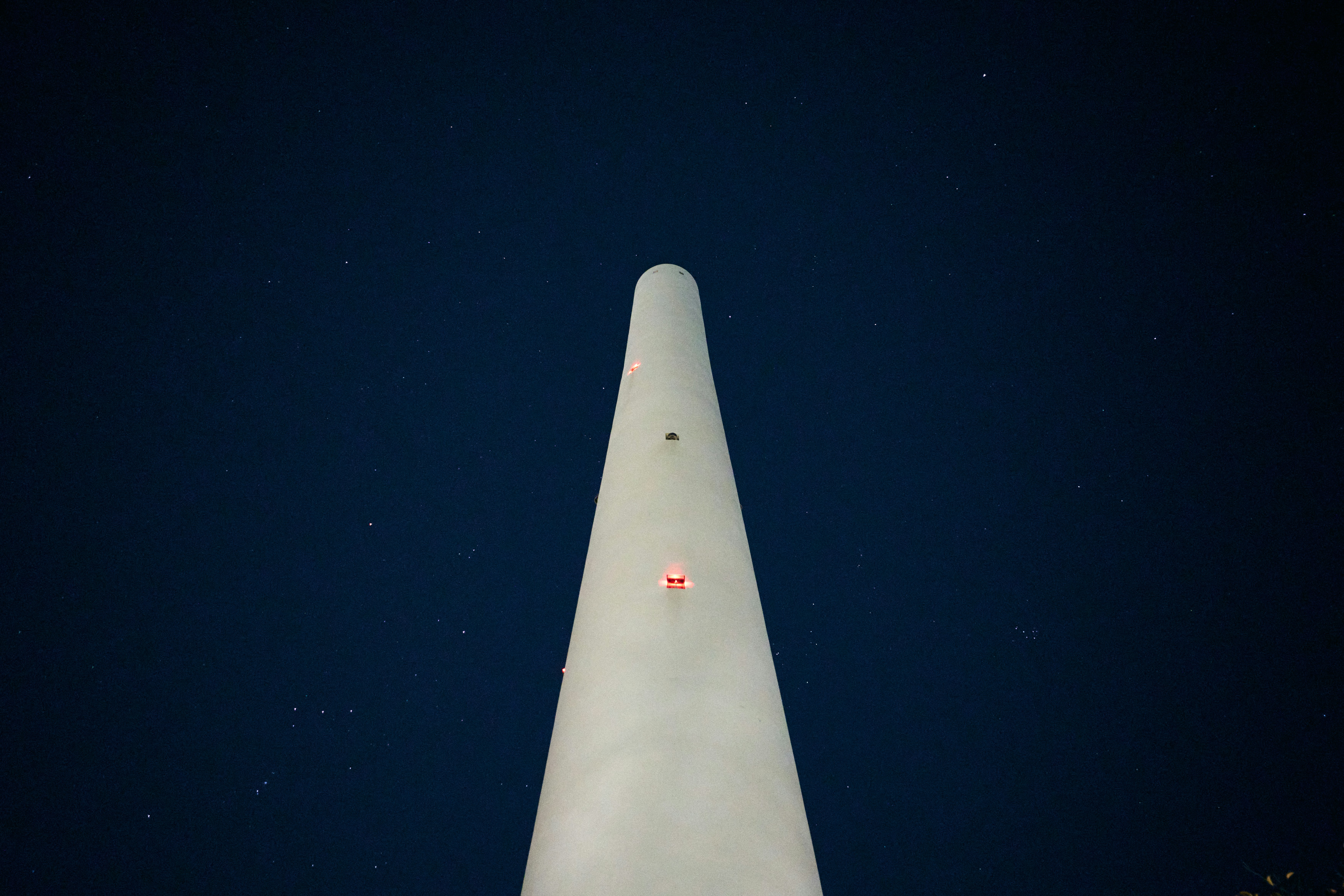 A very tall white object in the middle of the night