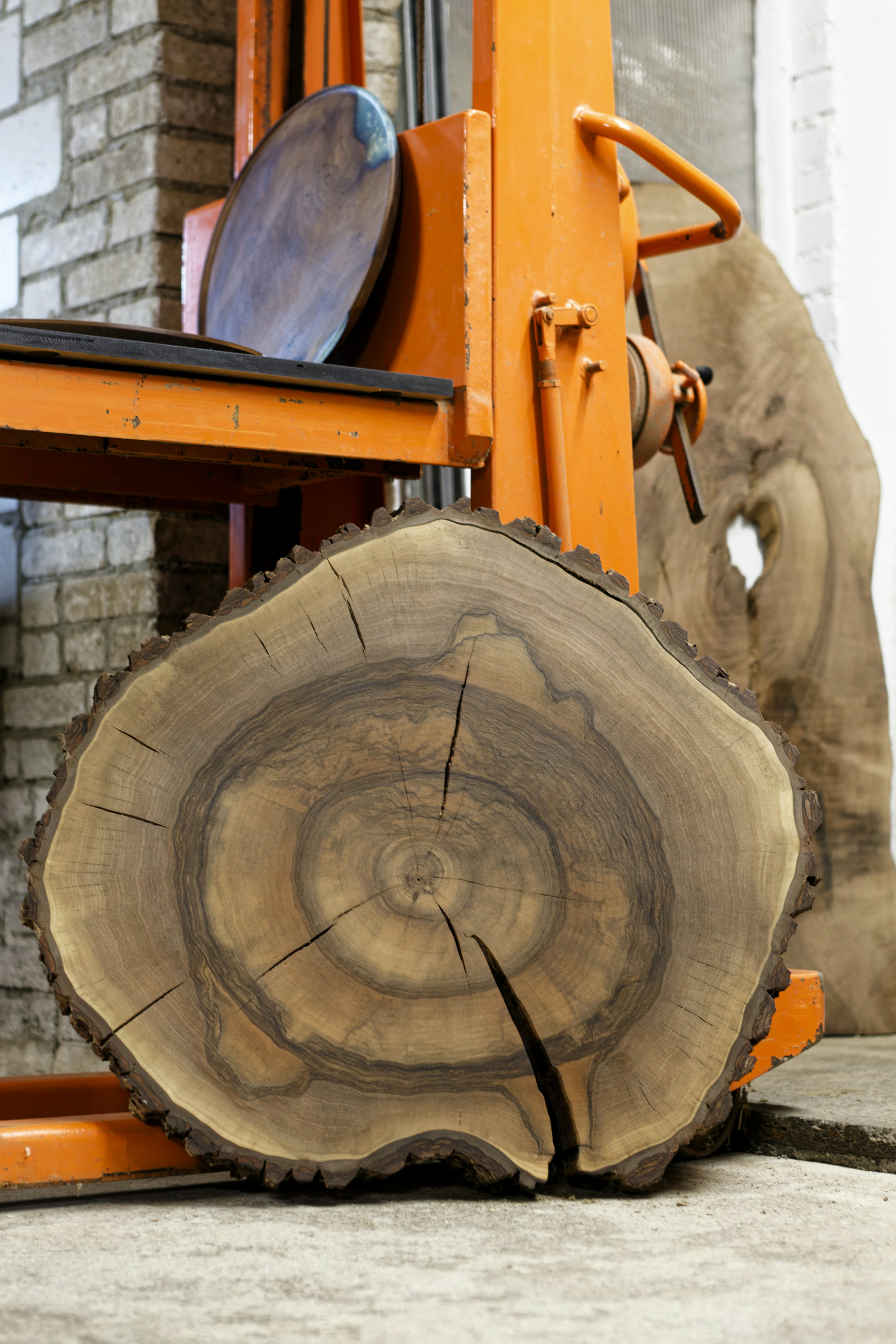 A forklift with a large piece of wood on top of it