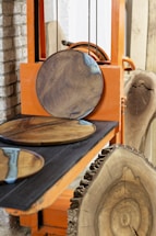 A couple of wooden plates sitting on top of a table