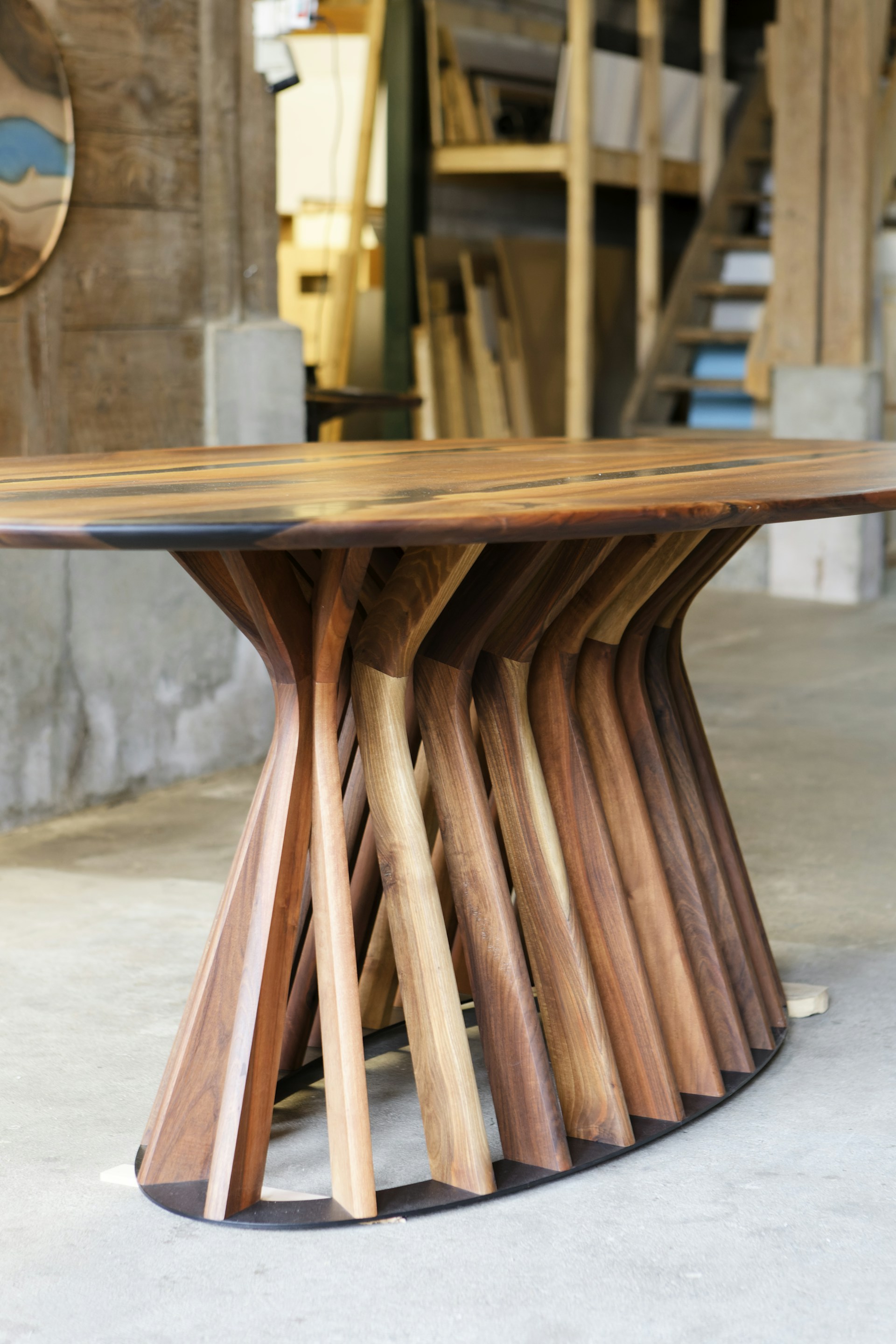 A table made out of wooden sticks and a clock