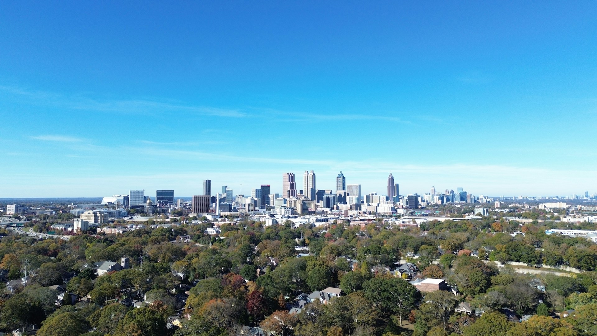 An aerial view of a city with a lot of trees