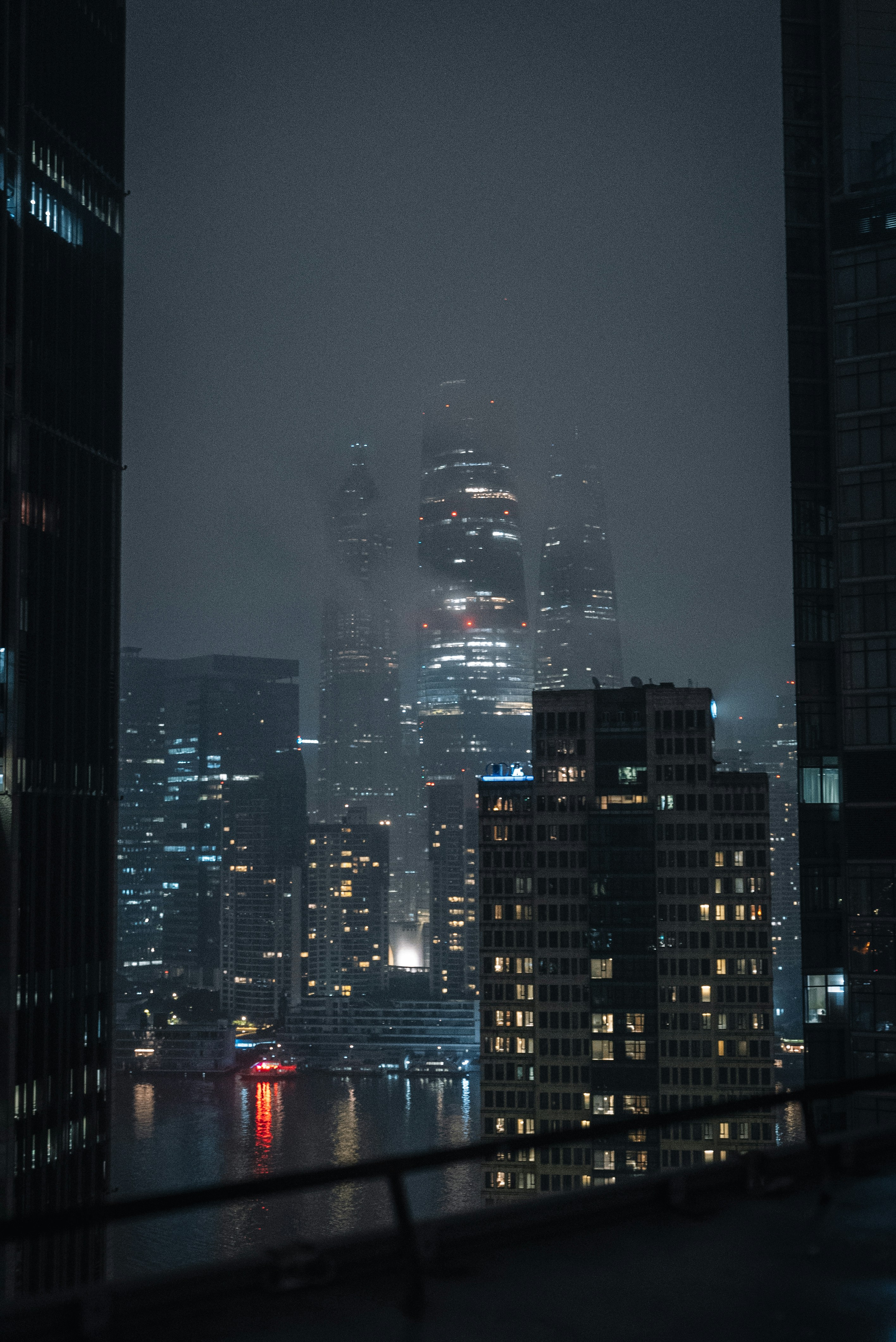 A view of a city at night from a rooftop