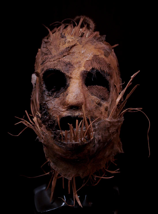 A creepy looking mask with hair on it