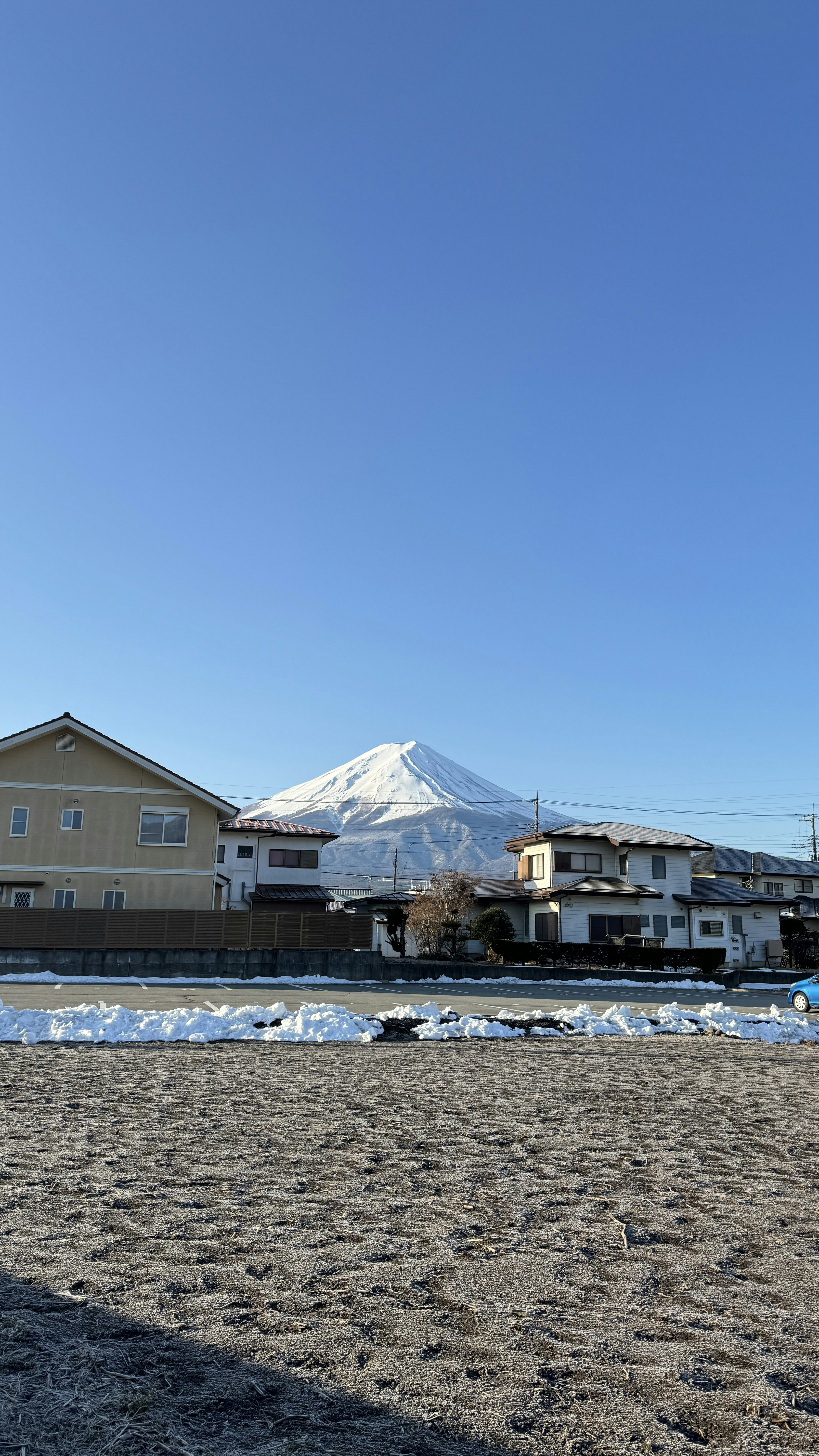 A view of a town with a mountain in the background