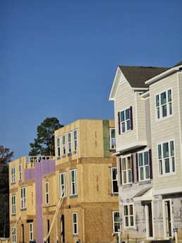 A row of houses under construction in a residential area