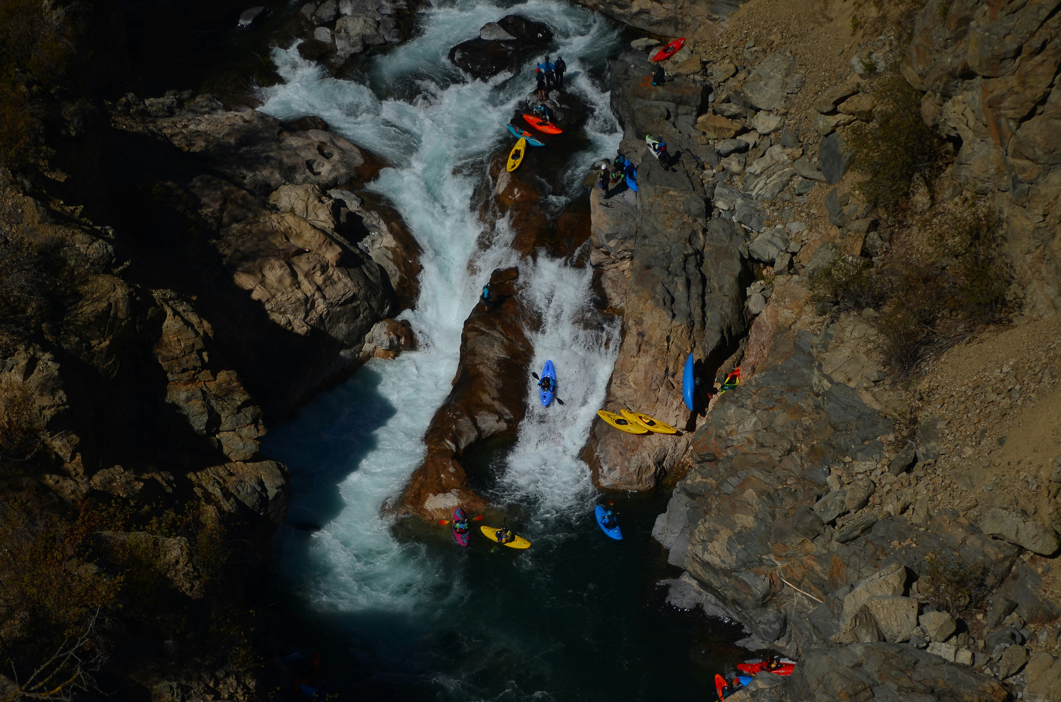 A group of people are rafting down a river