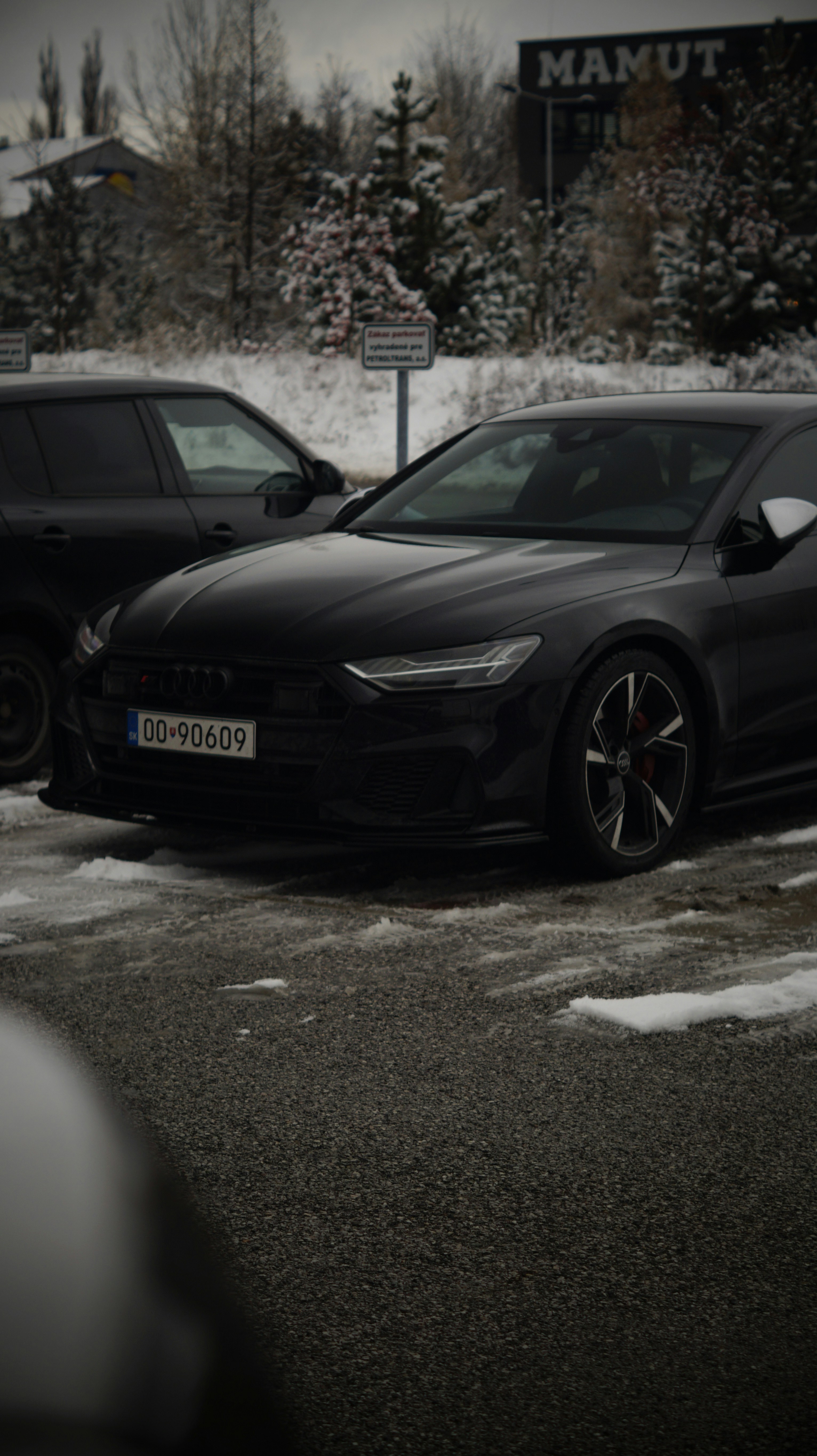 A couple of cars parked in a parking lot