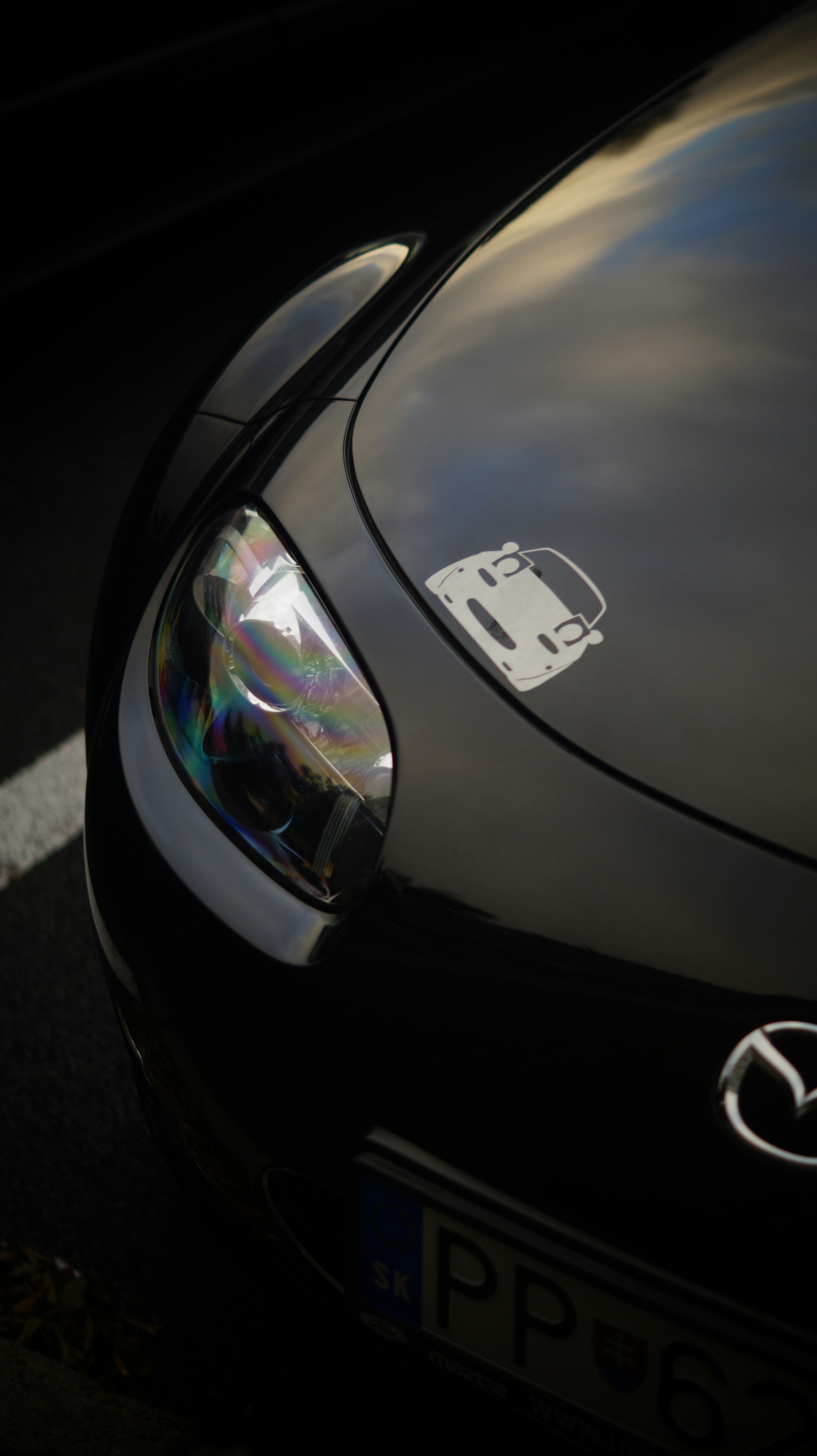 A close up of a car parked on the side of the road