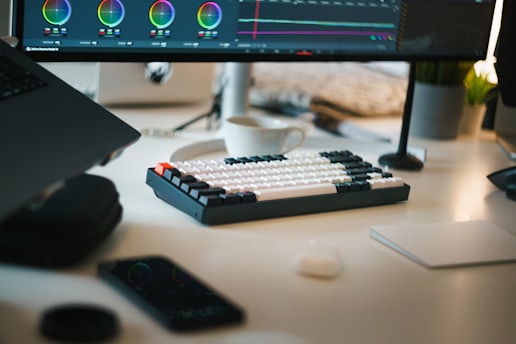 A computer monitor sitting on top of a desk
