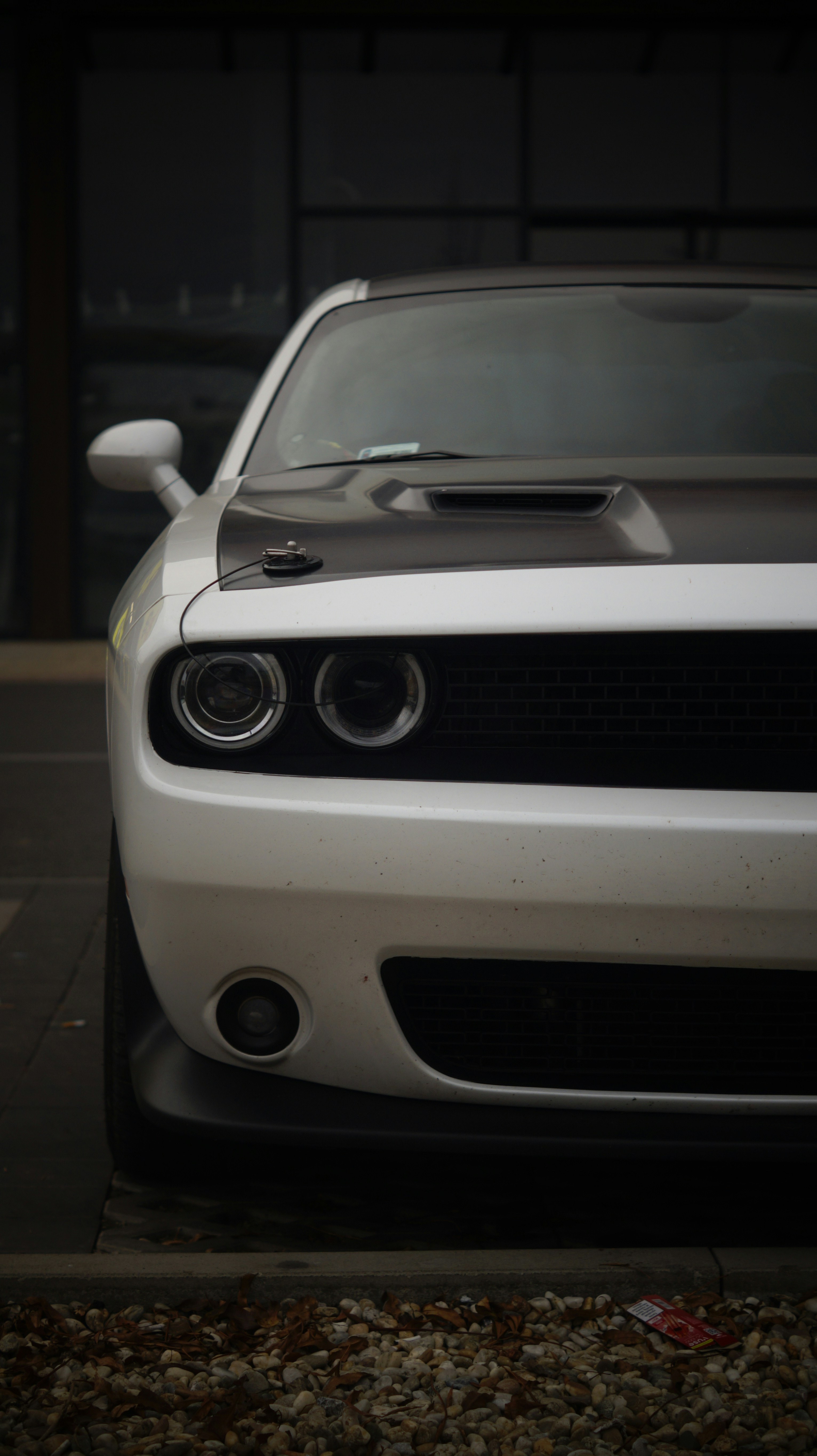 A white car parked on the side of the road