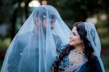 A man and a woman dressed in wedding attire