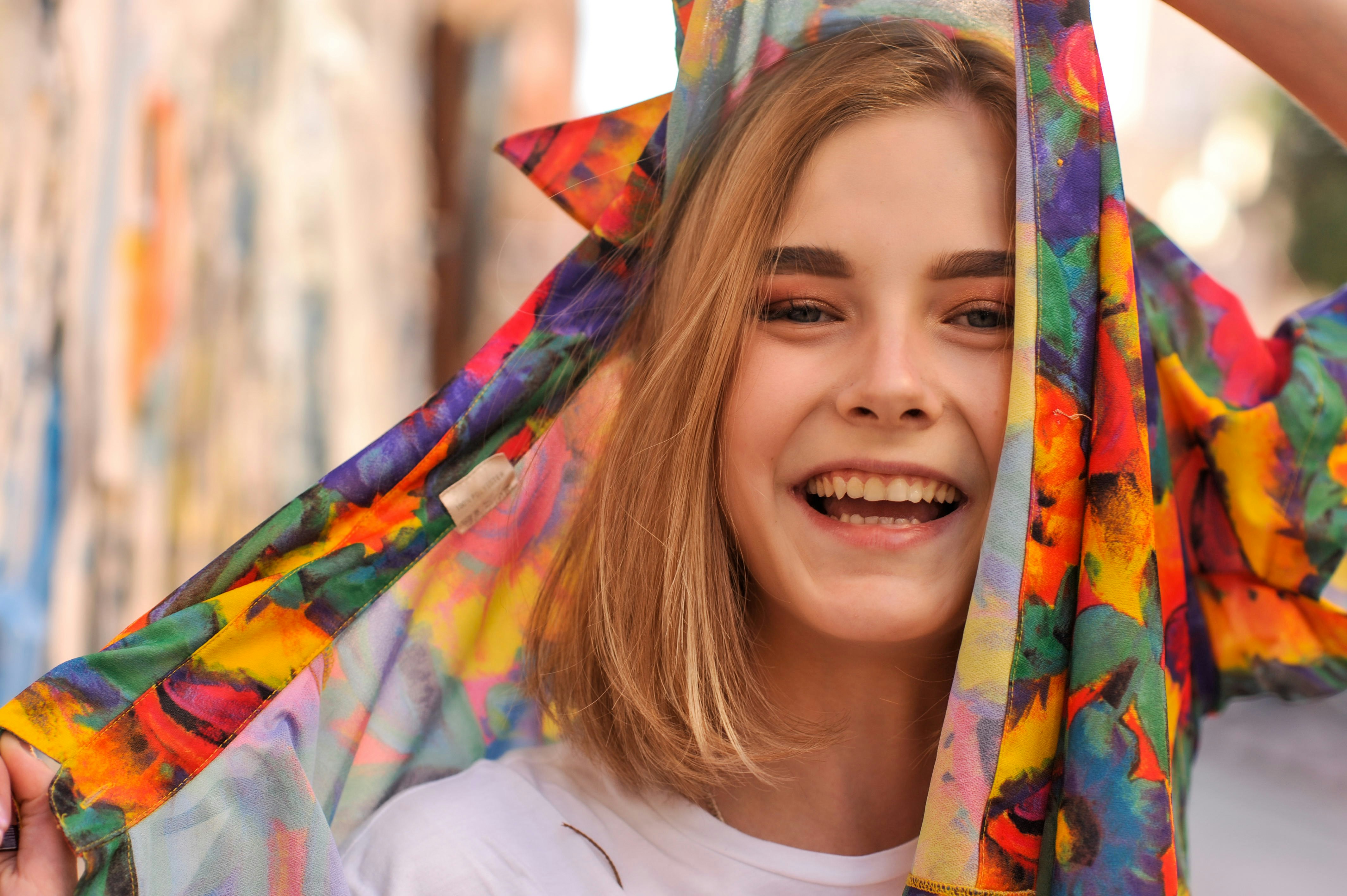 A woman with a colorful scarf around her head