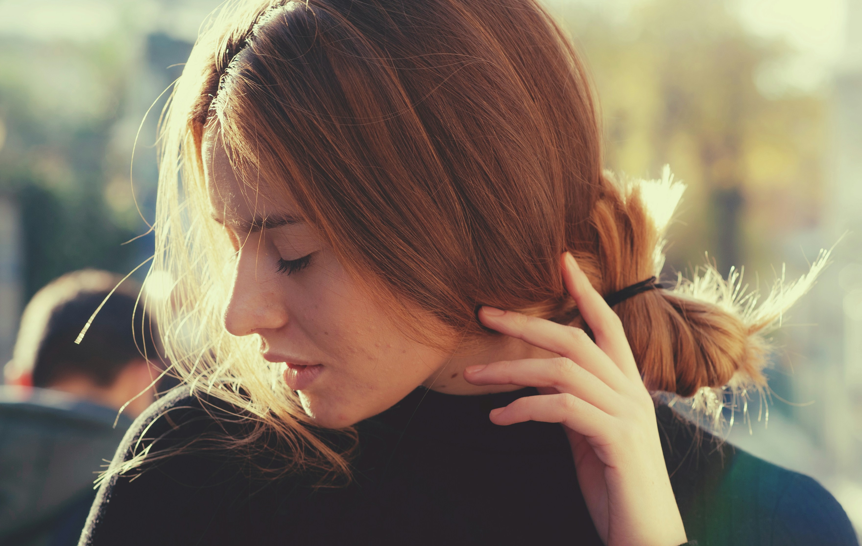 A woman with her hair in a pony tail