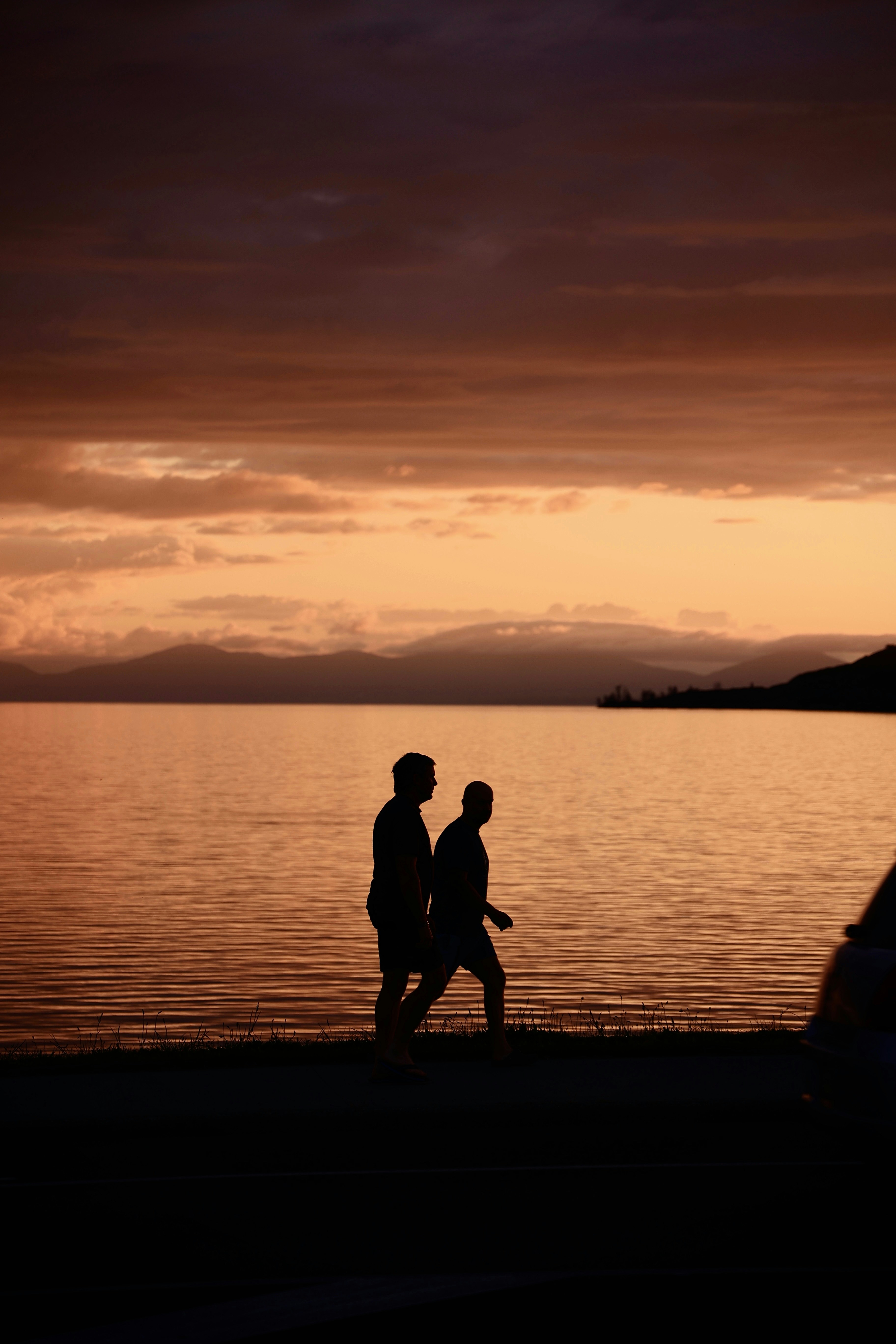 Two people walking on the beach at sunset photo – Free Beach Image on  Unsplash, image size:3000x4500