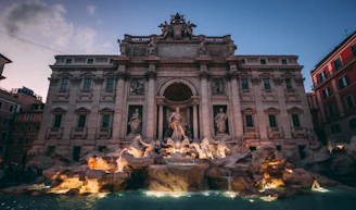 A large building with a fountain in front of it