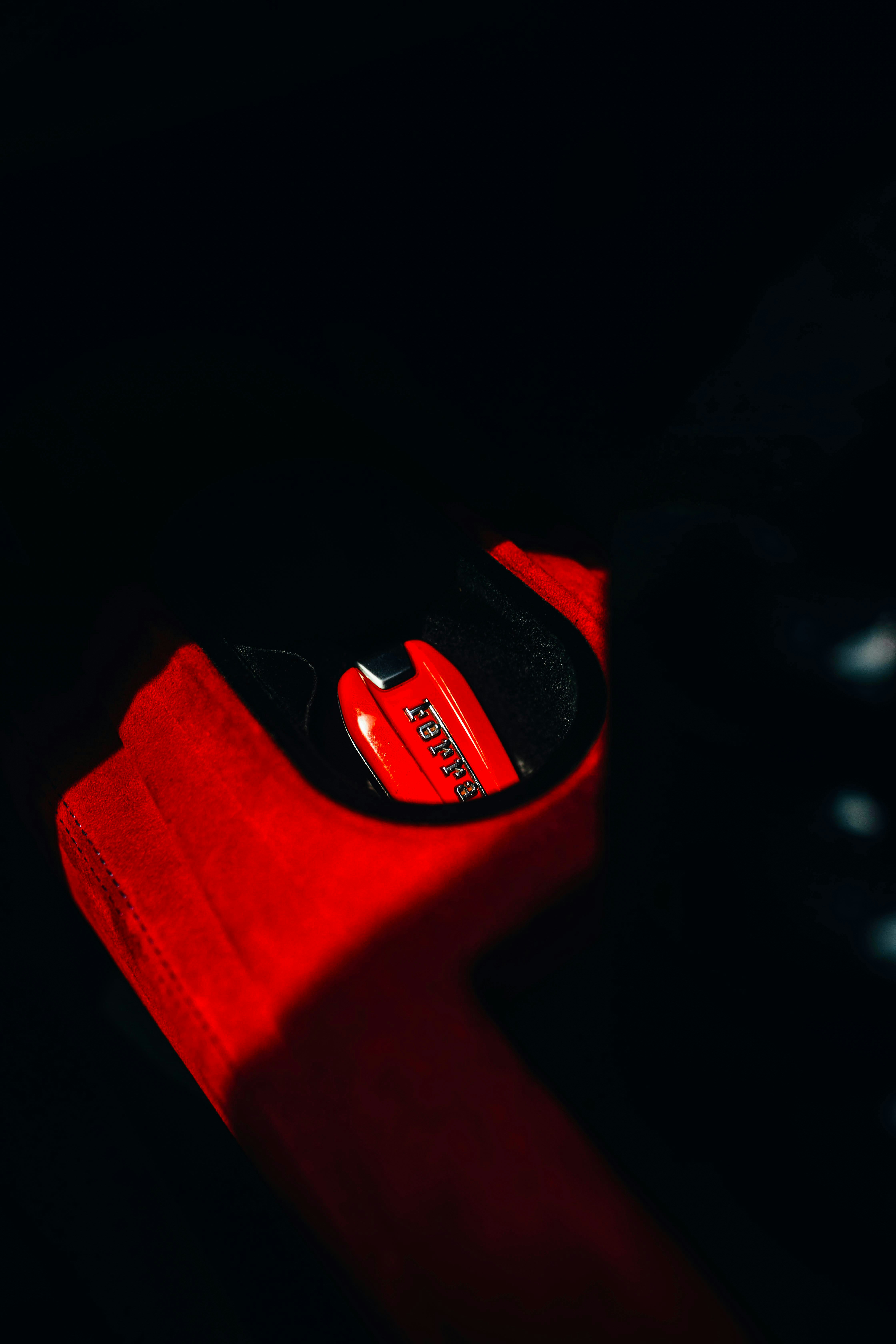 A close up of a red object in the dark