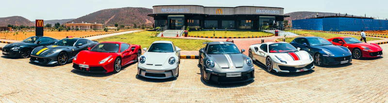 Fleet of luxury cars, representing a sugar momma's lifestyle