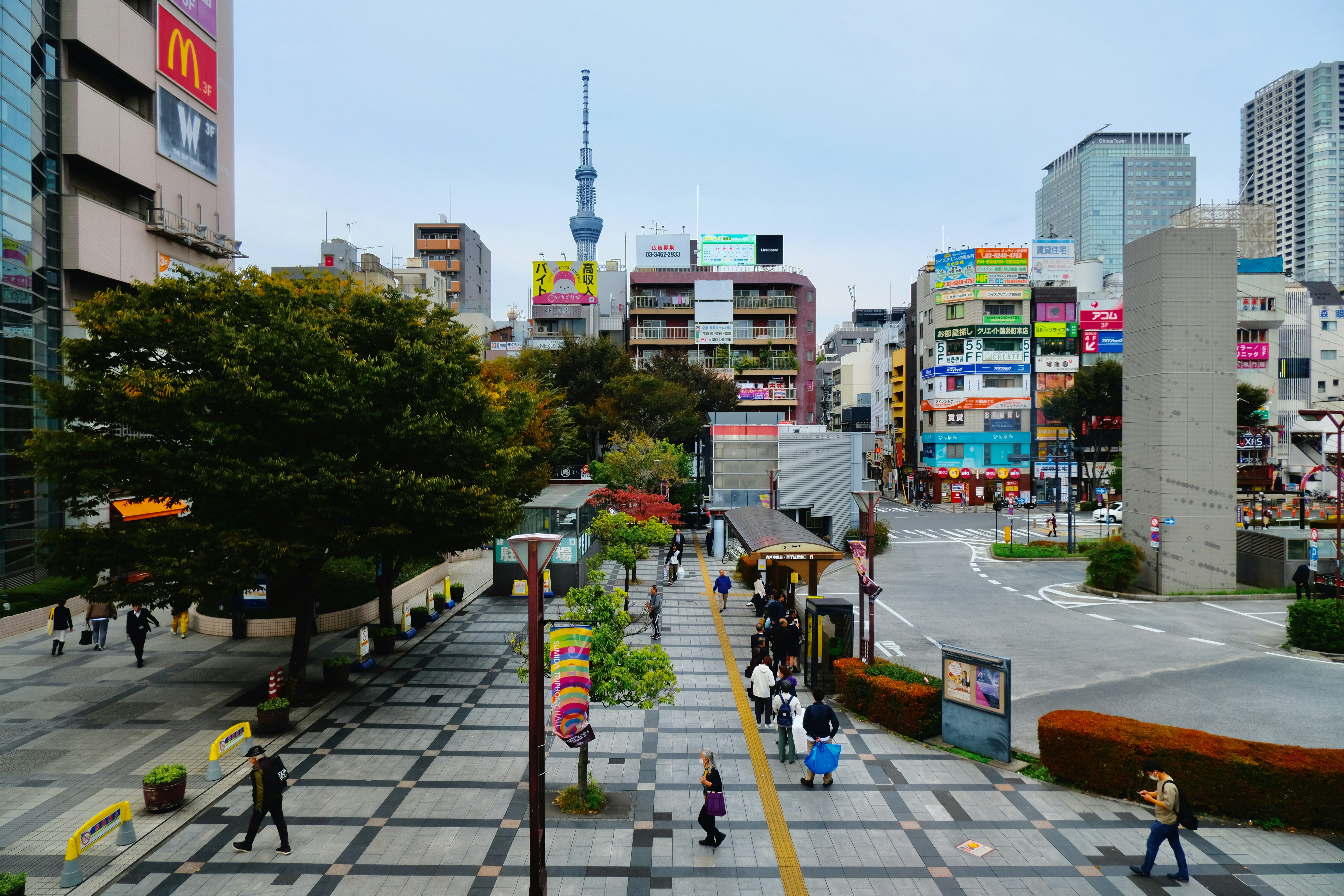 A city street with people walking on it