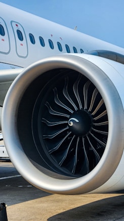 A jet engine sitting on top of an airport tarmac
