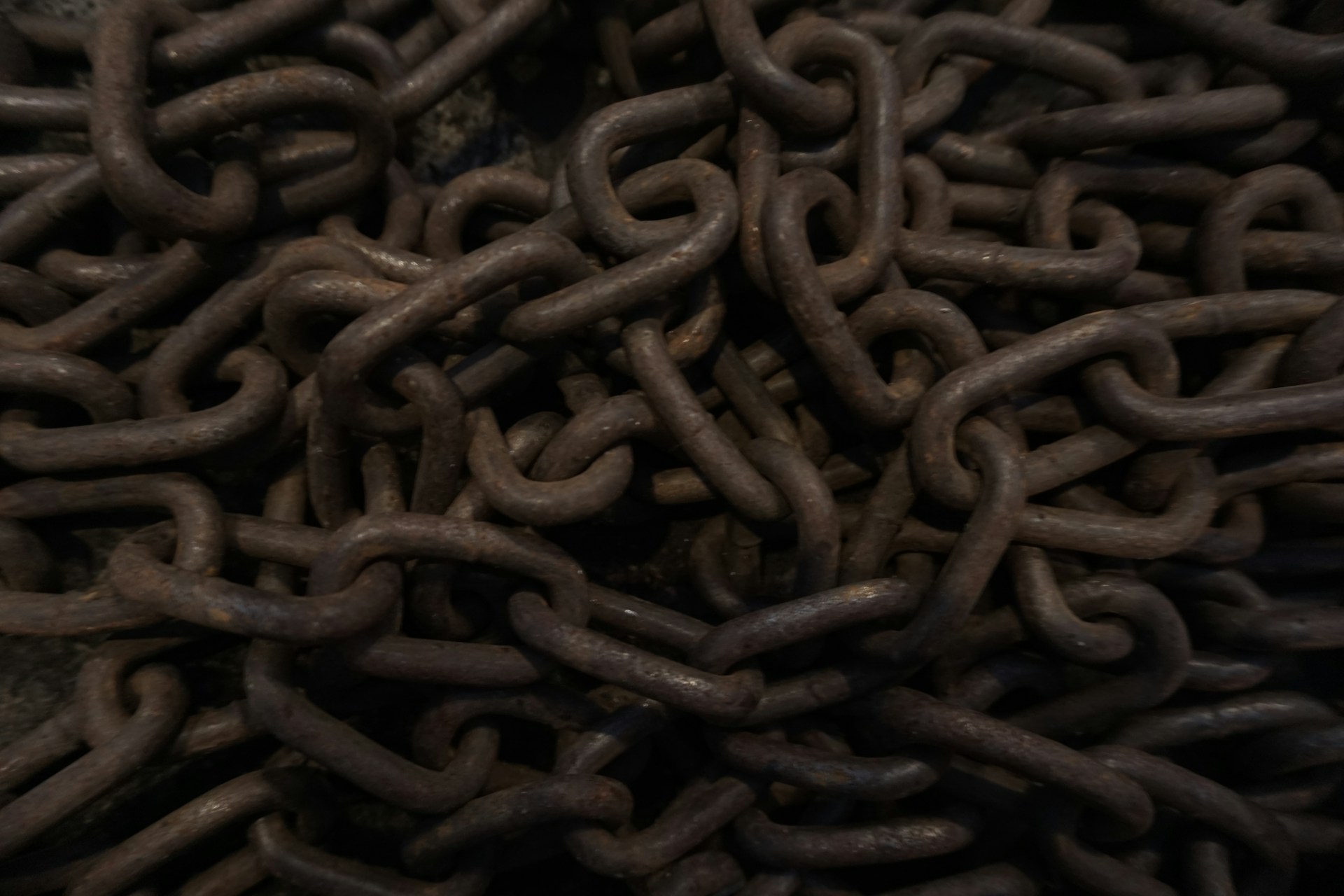 A pile of brown chains sitting on top of a table