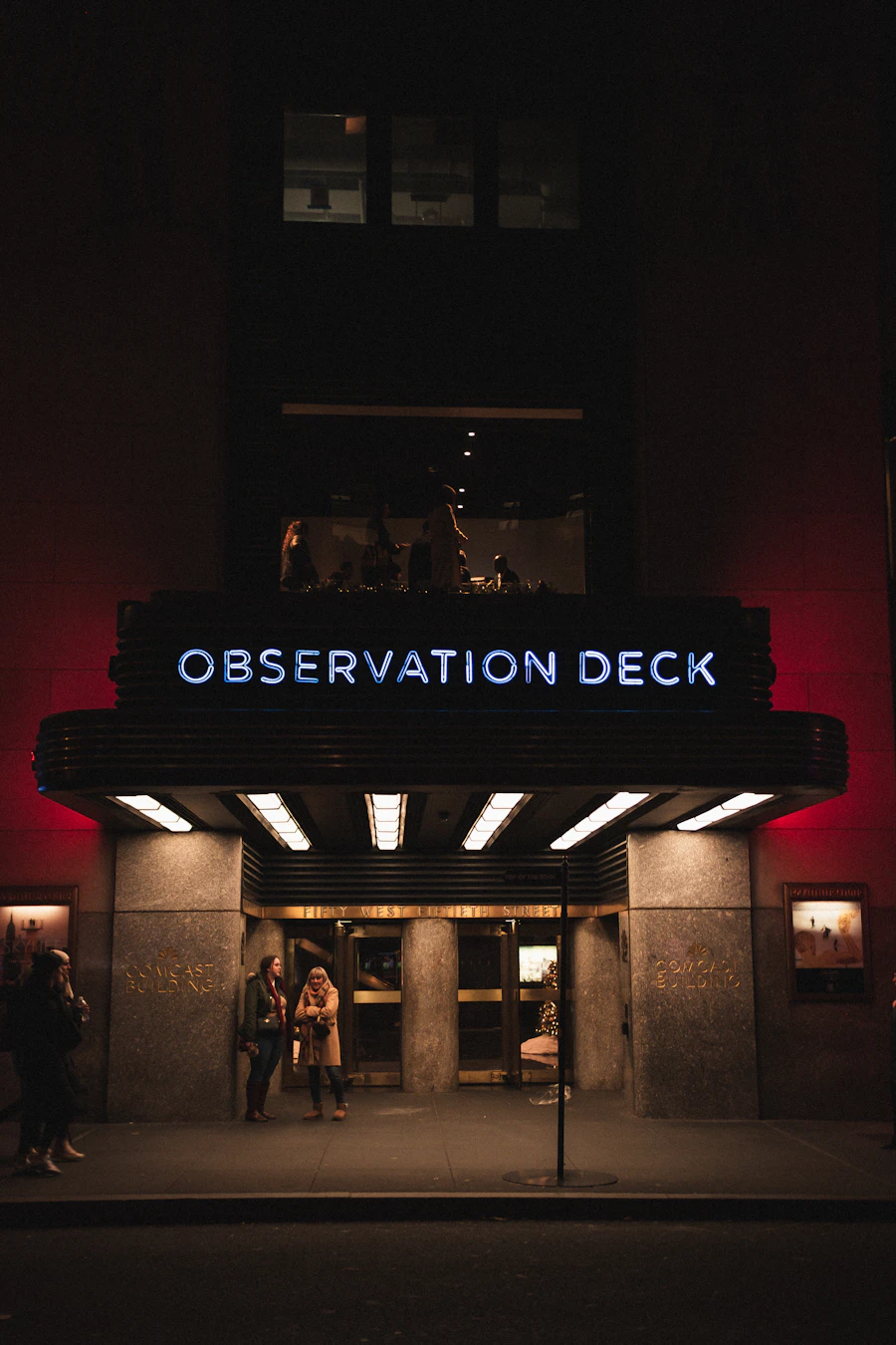 A glowing venue entrance at night — membership recognised at the door