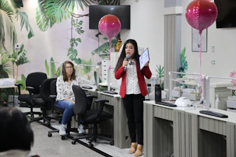 A woman standing in front of a group of people