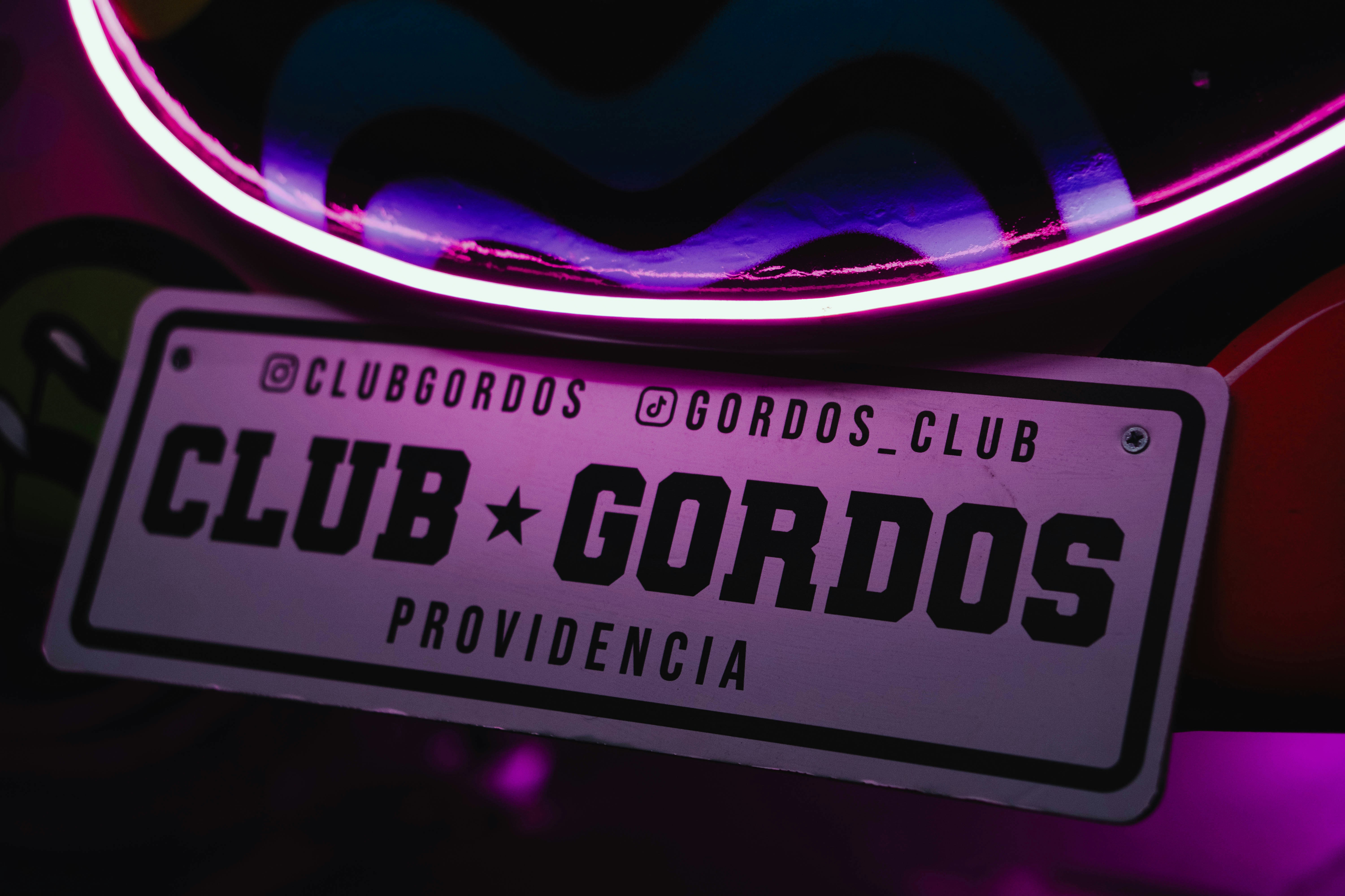 A close up of a neon sign on a car