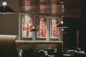 A restaurant with posters hanging from the ceiling