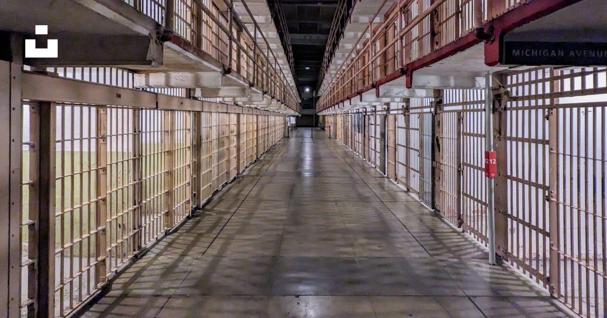 A long hallway in a jail with bars on the sides photo – Free Alcatraz ...