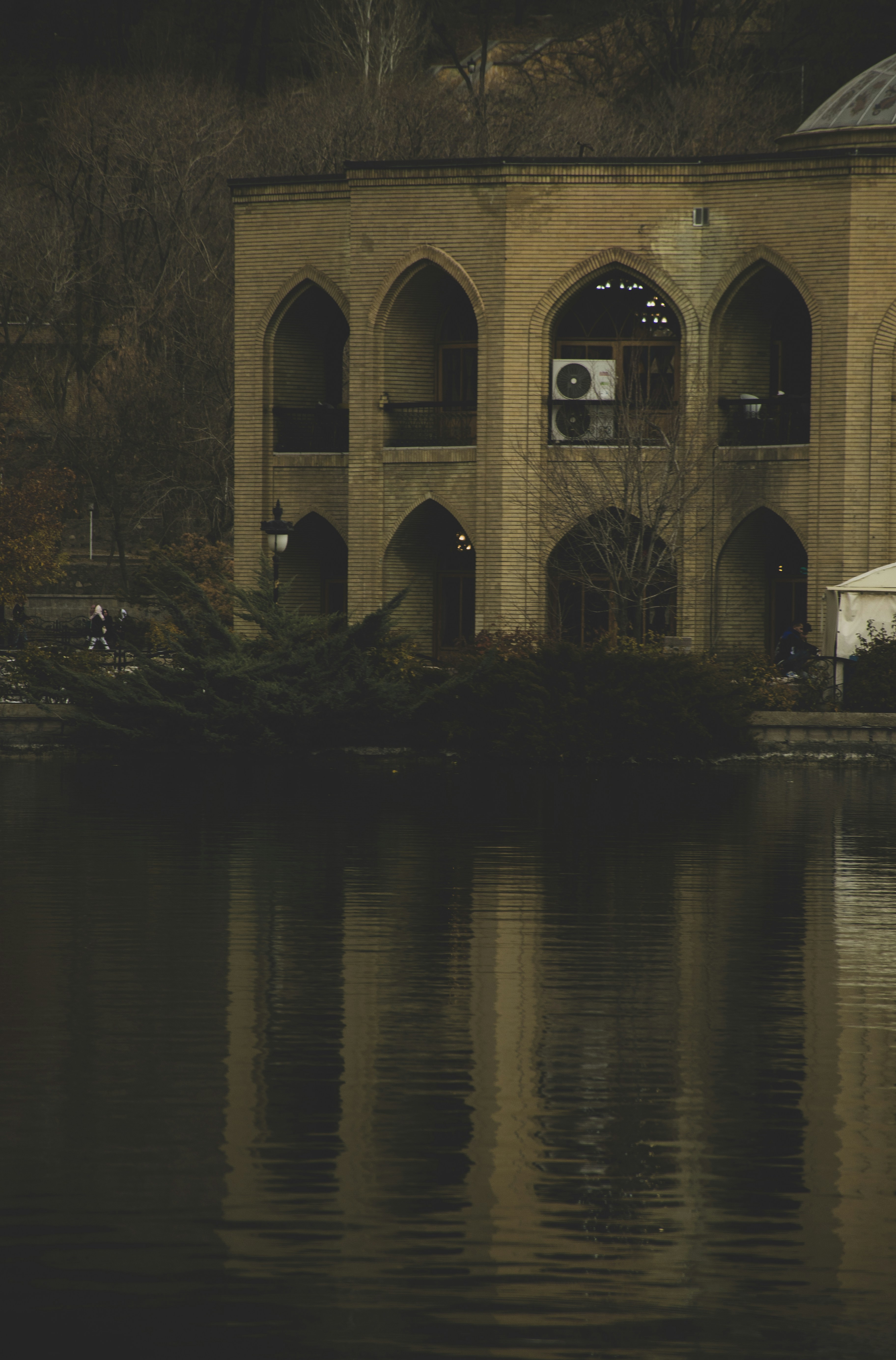 A large building sitting next to a body of water